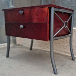 Gorgeous matching set of two cherry mahogany wooden end tables. Both pieces are heavy, well-constructed, and feature deep storage drawers with decorat