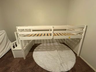 Twin loft bed with stairs and storage shelves