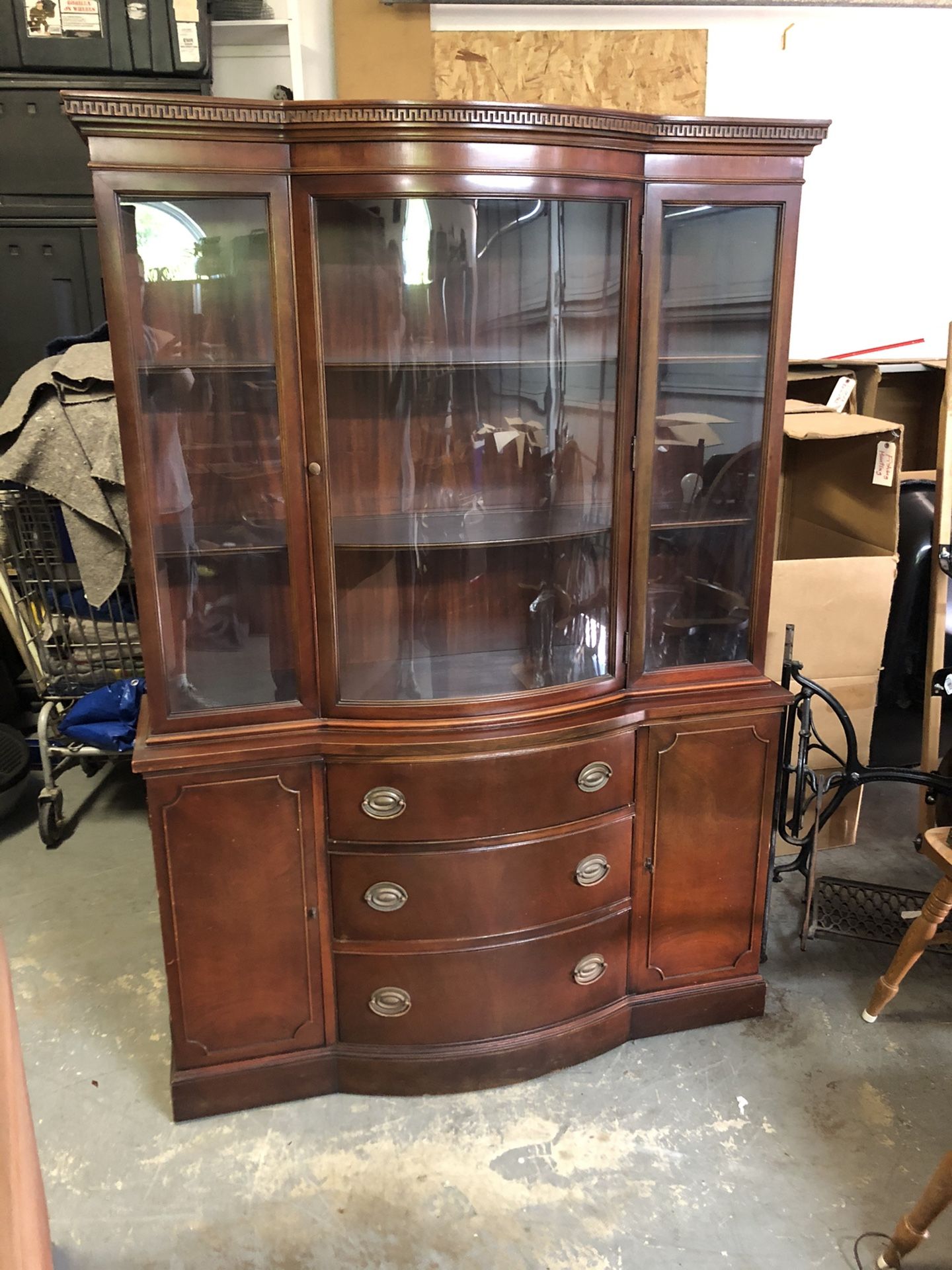 Drexel Travis court collection cherry Duncan Phyfe China cabinet. One solid piece 3 drawers 2 cabinets 2 shelves. glass in good condition. It’s been