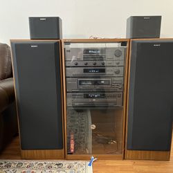 SONY 4 pc. home stereo system w/ pair of tower speakers, additional speaker & cabine