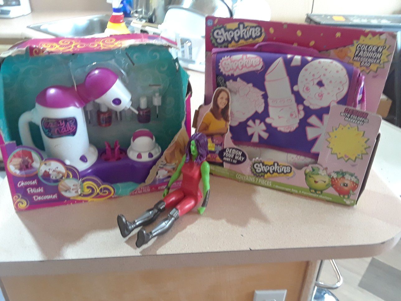 1 action figure, easy nails and shopkins decorate a bag