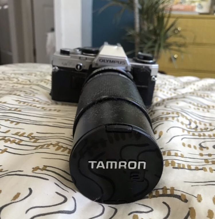Olympus OM 10 film camera with large lense