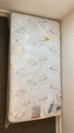 Kid size bed plastic still on