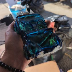 vintage Avon Dune Buggy cologne bottle from the 1970s, crafted from cobalt blue glass with a silver plastic engine cap.