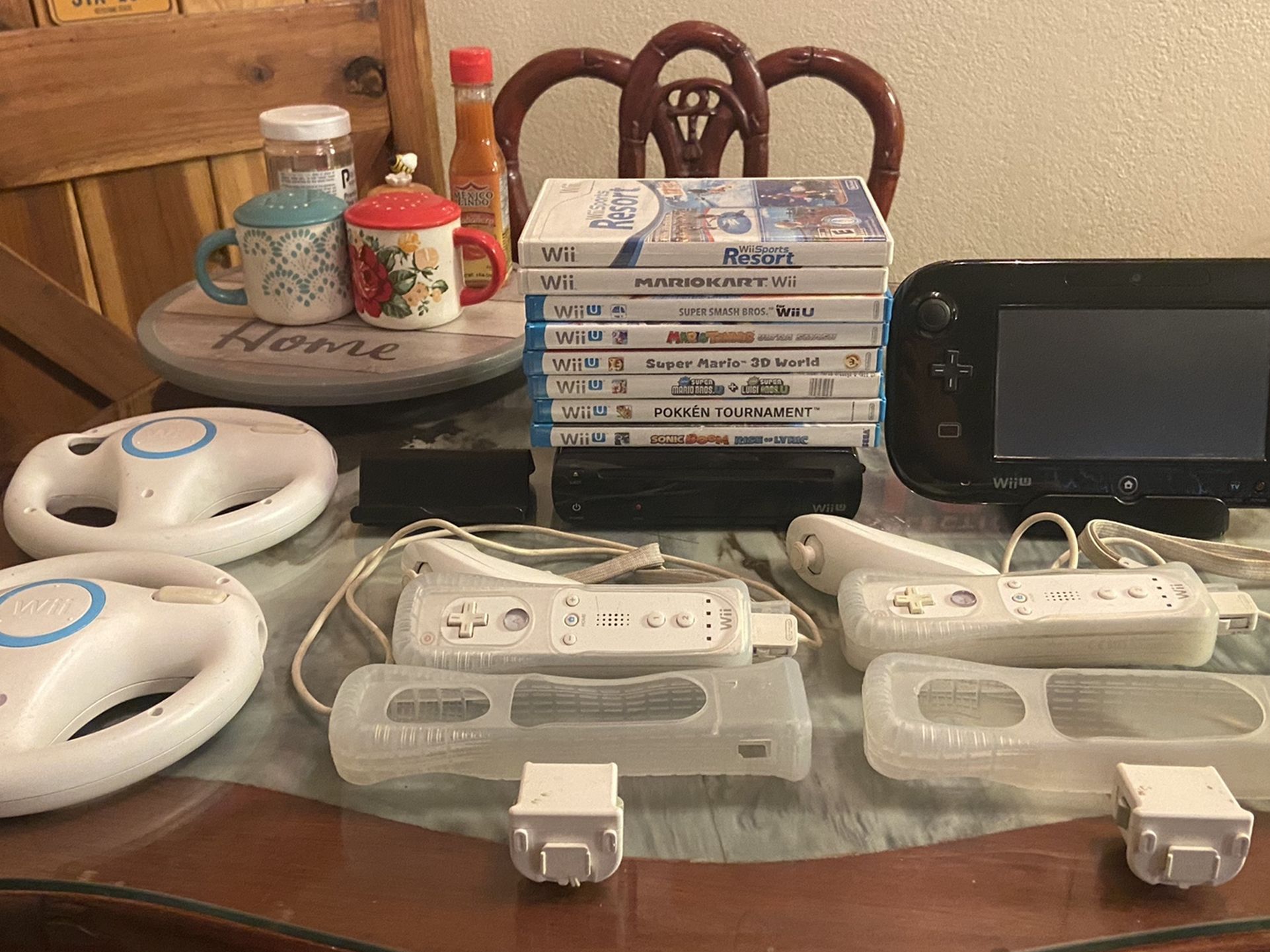 Nintendo Wii U Console 32GB Black Deluxe Set Bundle + 8 Games, 2 Wii Controllers, 2 Mario Kart Wheel Aceccories, and 2 Controller Motion Plus.