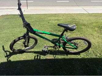 Green Mongoose Data X 1.2 BMX bike featuring black handlebars and a 20-inch frame.