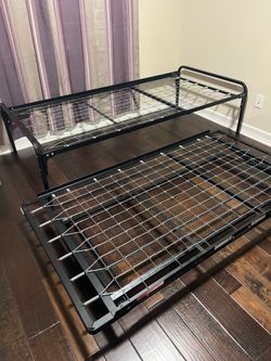 Twin bed frame and pop up trundle