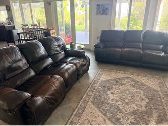 Free 2 piece leather couch with manual recliners