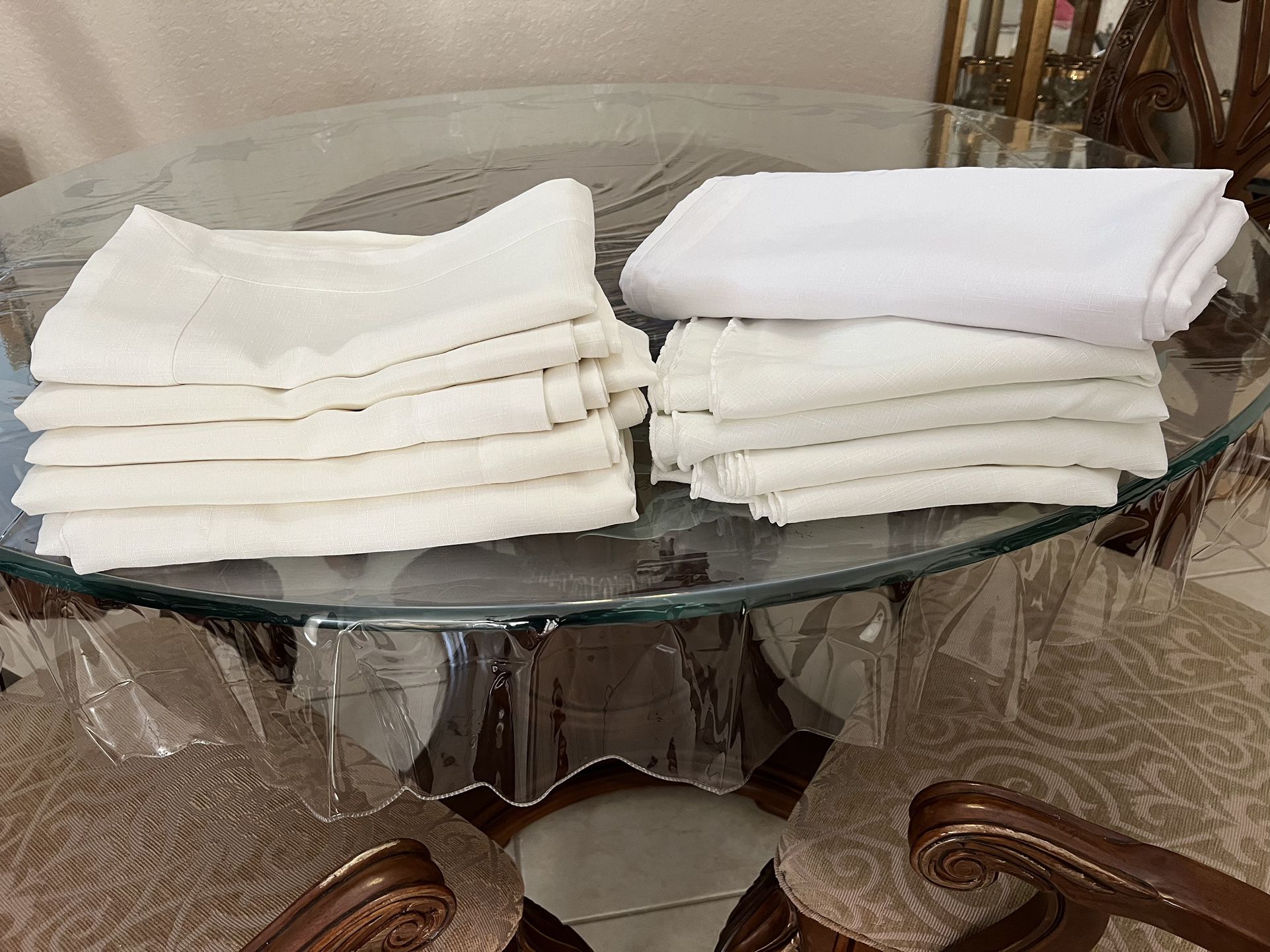 TEN table clothes , white/ivory, good washable fabric.  ($ 5.each) Used  once only. .