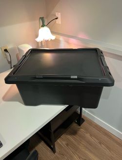 Free two large black plastic storage bin with lid