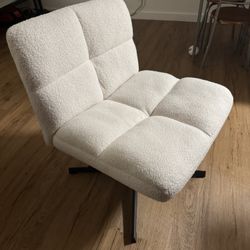 White upholstered armless swivel and height adjustable chair