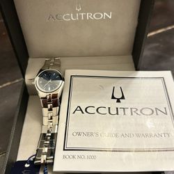 This watch is a Bulova Accutron, specifically the 26M04 model from the Lucerne collection. It is a Swiss watch for women that has a case and a stainle
