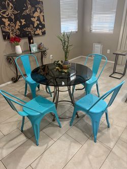 Round glass table + 4 teal metal chairs $100 OBO