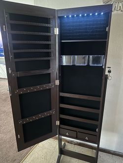 Mirror with storage for jewelry