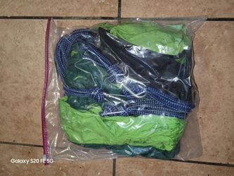 It is a parachute-material hammock that can be hooked up to function like a swing; I have only used it twice, so it is still like new.