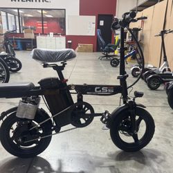 Front and rear shock-absorbing electric bicycles