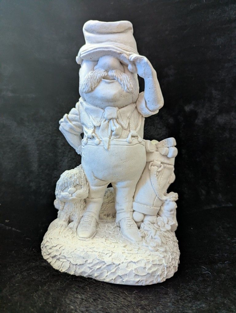 Figuring Statue Of Old Man Golfing With His Puppy