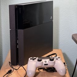 PS4 with white controller and cables (software updated to latest)