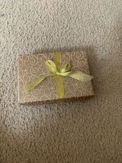 Small box with a few presents (hair care and face care stuff bracelets and craft materials)