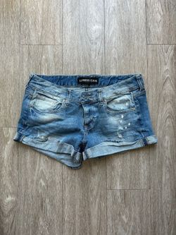 Express Women's low rise medium wash distressed demin shorts