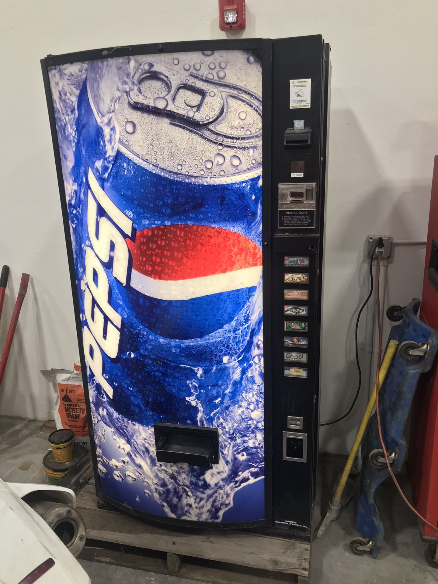 Pepsi vending machine. 8 selections. Coins and bills.