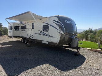2013 Outback 32ft 3 slide out  super clean