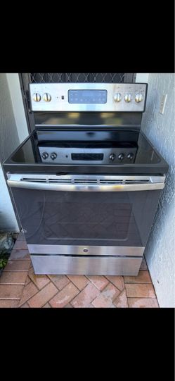 GE black and stainless electric stove works great GE black and stainless electric stove works great