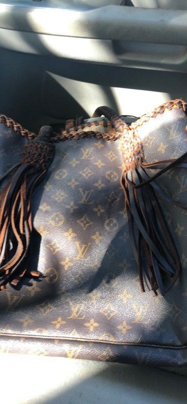 Louis Vuitton never cowhide braid