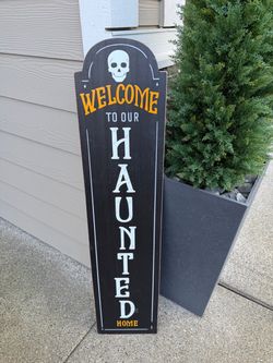 Wooden leaning Halloween sign front porch