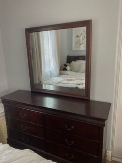 Dark wood 6-drawer dresser with matching mirror