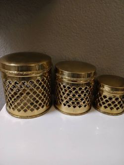 Vintage Regency pierced brass canister set