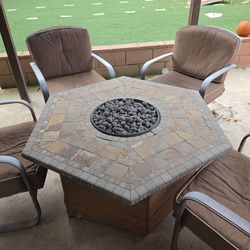 Propane fire pit with outdoor chairs