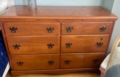 Antique dresser with matching mirror.