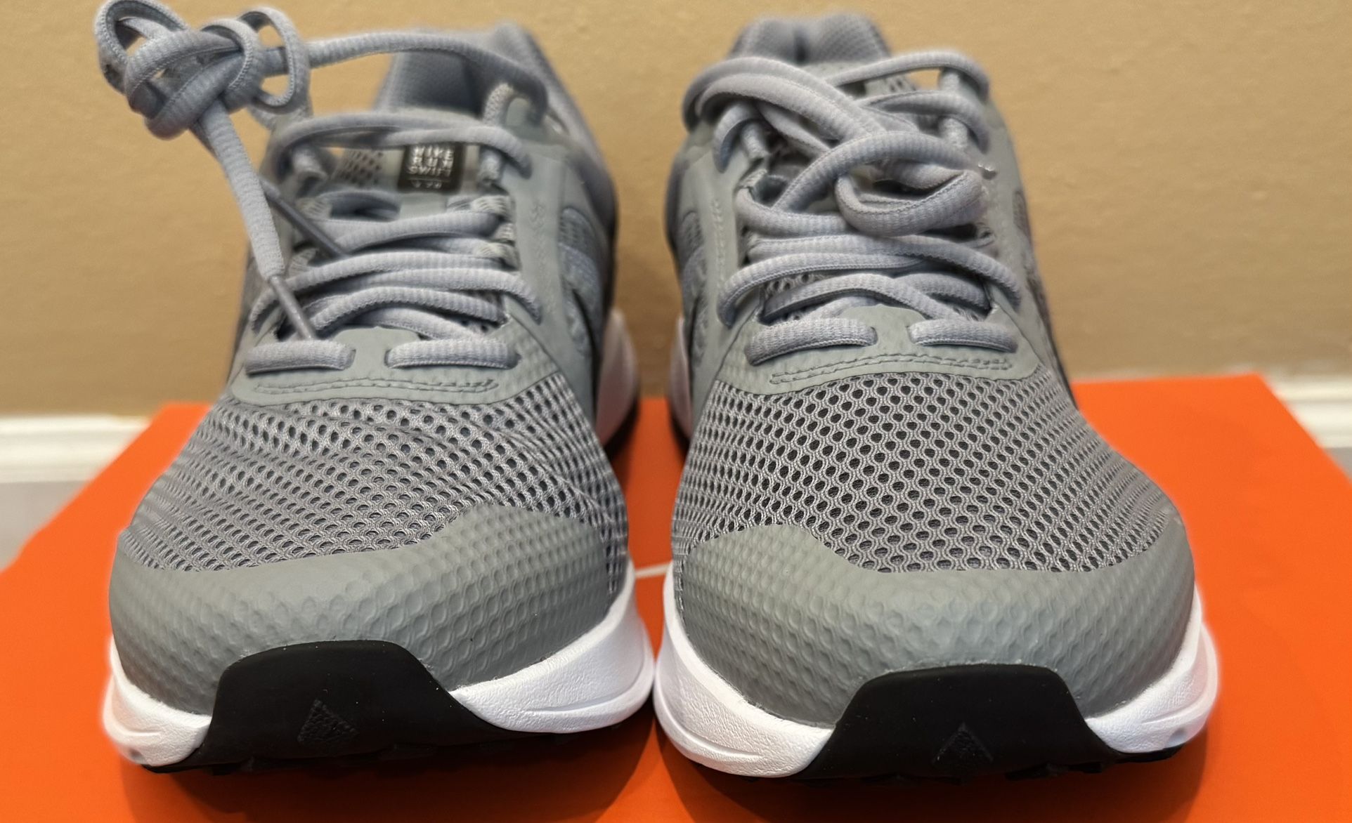 Nike brand shoes, size 10.5, in gray color,