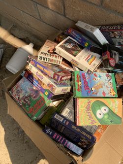 3 boxes filled with VHR MOVIES