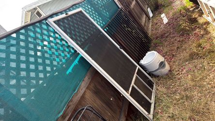 Exterior screen door with dog door