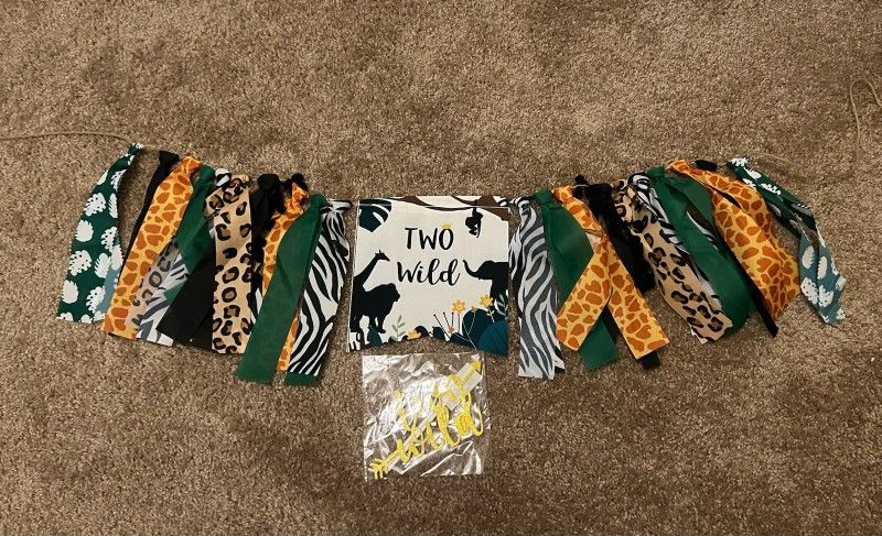 Two Wild high chair banner and two Wild cake topper (never opened) - $12 