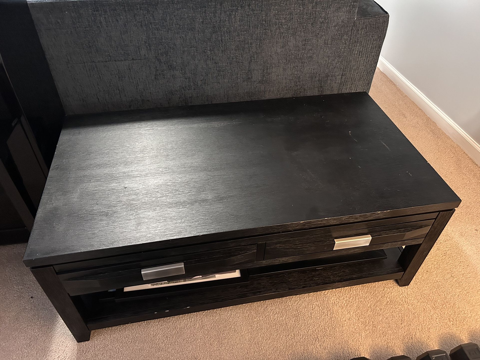 Black wooden coffee table with drawers