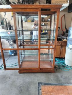 Display Case/Curio Cabinet..80 by 50 by 22..Sliding Door Lighted