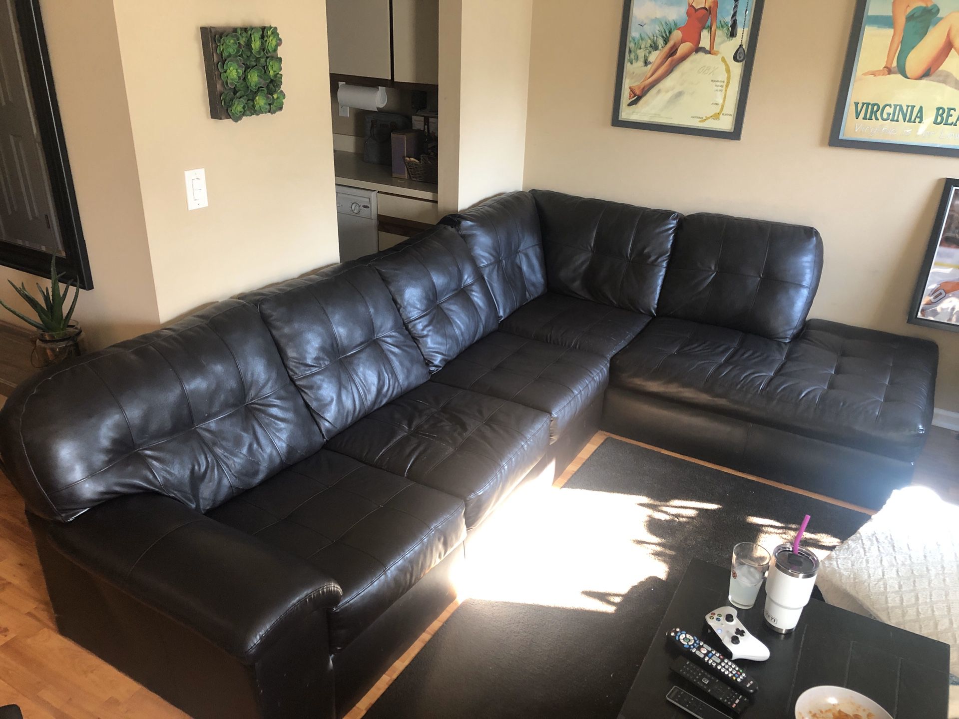 Black leather sectional couch