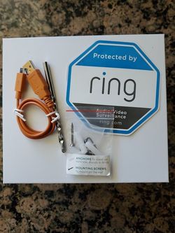 Ring Installation Kit (Mounting Screws And Anchors) With Charger And Security Sticker.