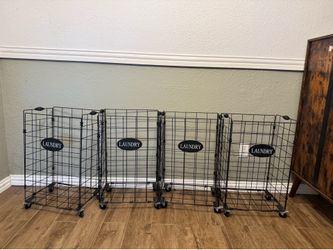 Four  Black Wired Farmhouse Style Laundry Baskets on Wheels. No Liners.  Good Condition. Asking 40.00 for the Set. You can buy cloth liners . Cost 48