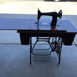 Antique Singer sewing machine with table and cast iron base 