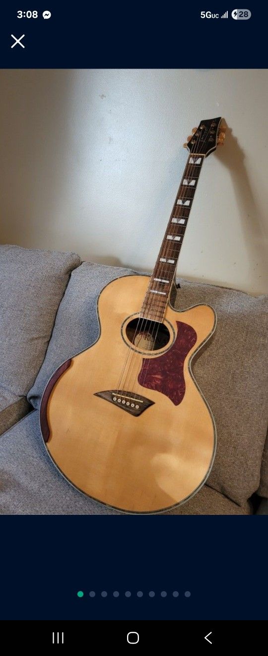 Kona jumbo cutaway body acoustic guitar.  Plays and sounds nice