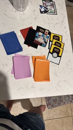 Pokemon Card Sleeves in Blue, Red, Purple, Orange, and Black