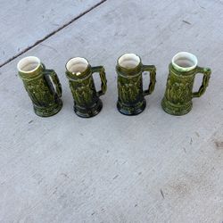 Four Piece Antique Beer Stein Set