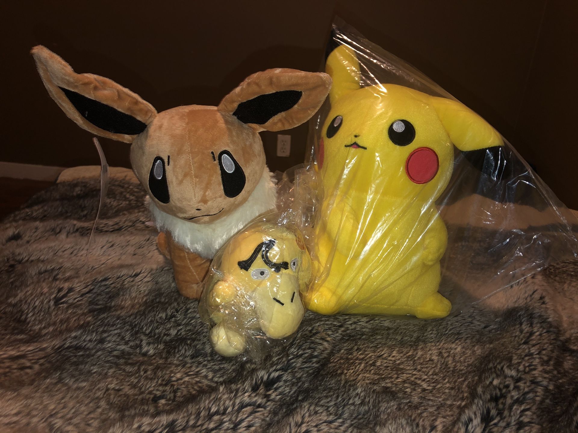 Pokémon eevee, pikachu, and psyduck plush