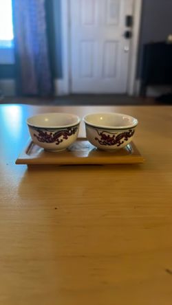 Pair of tiny teacups with bamboo stand and temperature color changing dragons