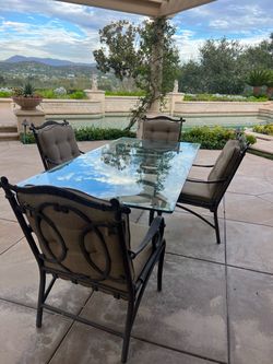 Wrought Iron Outdoor Dining Set with Glass Top & Cushioned Chairs (90"L x 44"W x 27.5"H)