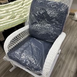 Wicker Rocking Chair With Navy Blue Pillows 